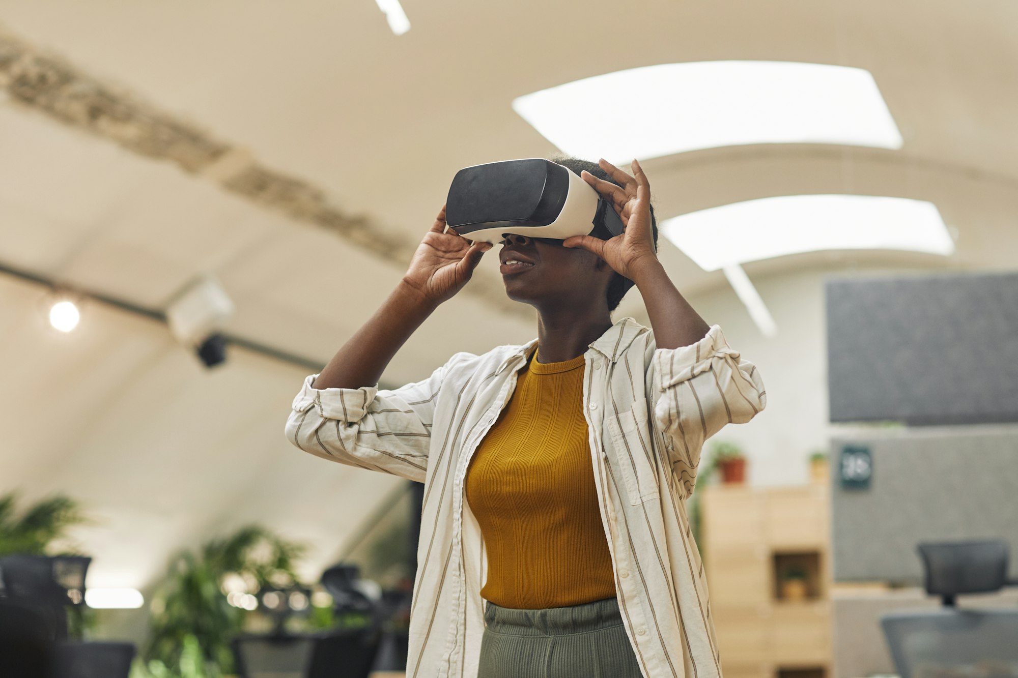 African Woman Enjoying VR in Office